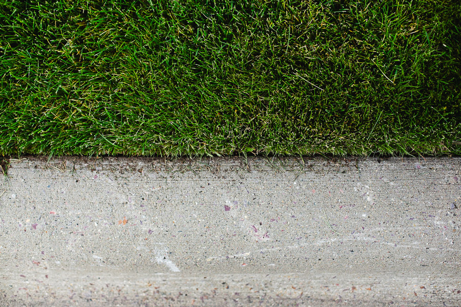 Sharp clean lawn edge along a sidewalk